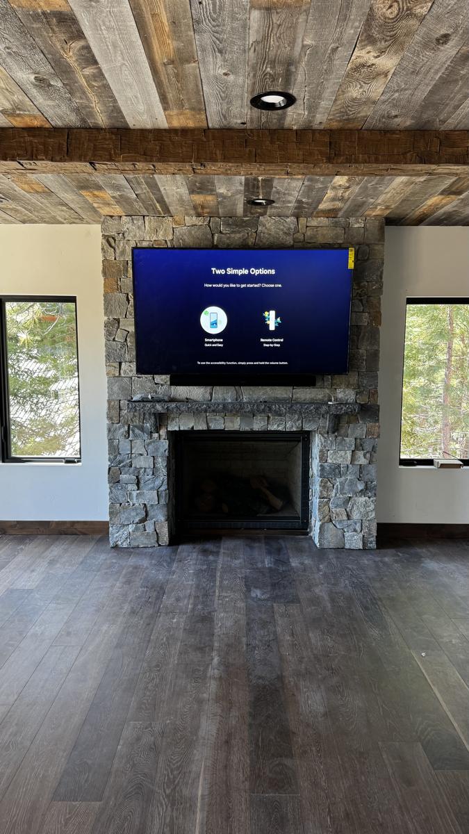 Mountain home theater on stone fireplace