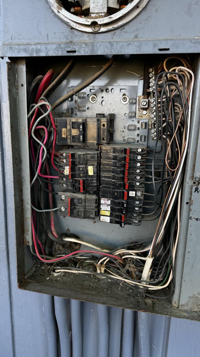 BEFORE — aging panel with obsolete breakers